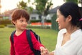 Mother and son holding hand during walking in park together. Loving family and Home sweet home concept Royalty Free Stock Photo