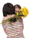 Mother and son hugging with flowers Royalty Free Stock Photo