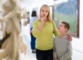 Mother and son looking at expositions in museum Royalty Free Stock Photo