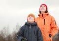 Mother and son looking in sky at winter Royalty Free Stock Photo