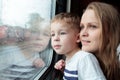 Mother and son looking through a train window Royalty Free Stock Photo