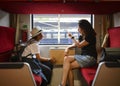 Mother and son looking through a train window as they enjoy a days travel at Thailand Royalty Free Stock Photo