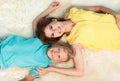 Mother and son lying on fuzzy rug, Royalty Free Stock Photo