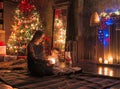 Mother and son in mysteriously lighted Christmas decorated room