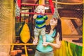 Mother and son passes the obstacle course in the sports club