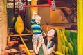 Mother and son passes the obstacle course in the sports club