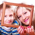 Mother and son play with empty frame.