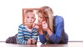 Mother and son play with empty frame.