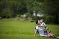 Mother and son play in grass Royalty Free Stock Photo