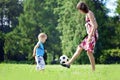 Mother and son playing ball in the park. Royalty Free Stock Photo