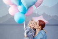 Mother and son playing with balloons. Concept of happy family. Birthday of the kid Royalty Free Stock Photo