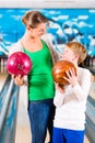 Mother and son playing at bowling center Royalty Free Stock Photo