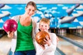 Mother and son playing at bowling center Royalty Free Stock Photo