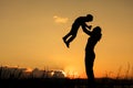 Mother and son playing on the coast of lake Royalty Free Stock Photo