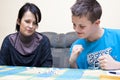 Mother and son playing dice Royalty Free Stock Photo