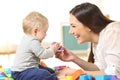 Mother and son playing on the floor Royalty Free Stock Photo