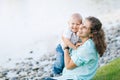 Mother and son playing near the lake Royalty Free Stock Photo