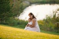 Mother and son playing near the lake Royalty Free Stock Photo