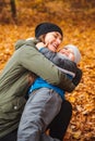 mother with son playing outdoors at autumn city park Royalty Free Stock Photo