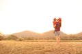 A mother and son playing outdoors at sunset with love Royalty Free Stock Photo