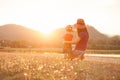 A mother and son playing outdoors at sunset. marthor day Royalty Free Stock Photo