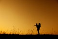 A mother and son playing outdoors at sunset Silhouette