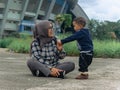 mother and son playing at the park