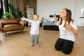 mother and son playing with soap bubbles. The child enjoys the soap bubbles. Family sitting at home playing with soap Royalty Free Stock Photo