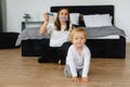 mother and son playing with soap bubbles. The child enjoys the soap bubbles. Family sitting at home playing with soap Royalty Free Stock Photo