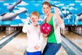 Mother and son playing together at bowling Royalty Free Stock Photo