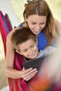 Mother and son playing together on tablet Royalty Free Stock Photo