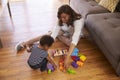 Mother And Son Playing With Toys On Floor At Home Royalty Free Stock Photo