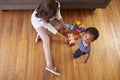 Mother And Son Playing With Toys On Floor At Home Royalty Free Stock Photo