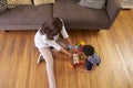 Mother And Son Playing With Toys On Floor At Home Royalty Free Stock Photo