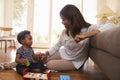 Mother And Son Playing With Toys On Floor At Home Royalty Free Stock Photo