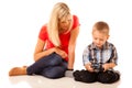 Mother and son playing video game on smartphone Royalty Free Stock Photo