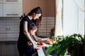 mother and son prepare food in the kitchen healthy food salad vegetables Royalty Free Stock Photo