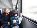 Mother and son in a railway carriage