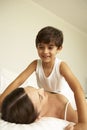 Mother And Son Relaxing On Bed Royalty Free Stock Photo