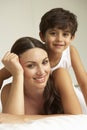 Mother And Son Relaxing On Bed Royalty Free Stock Photo