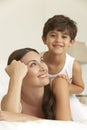 Mother And Son Relaxing On Bed Royalty Free Stock Photo