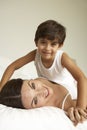 Mother And Son Relaxing On Bed Royalty Free Stock Photo