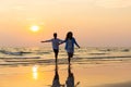 Mother and son running along a beach, Asian happy family parent with child boy running and having fun on the beach Royalty Free Stock Photo