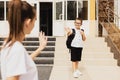 Mother and son say goodbye on the first day of school right in front of the .