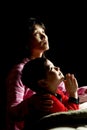 Mother and son saying prayers. Royalty Free Stock Photo