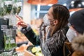 Mother and son shopping groceries wearing ffp2 face mask