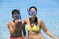 Mother and son snorkeling on the beach Royalty Free Stock Photo
