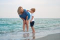 Mother son spending time together sea vacation Young mom child little boy walking beach Royalty Free Stock Photo