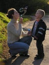 Mother with son on sundown with soapy bubble