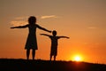 Mother and son on sunset stretching